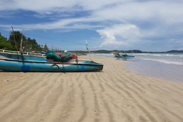 Fototapeta na wymiar boat on the beach of KoggalA, Sri Lanka