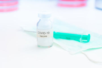 Nobel coronavirus covid-19 vaccine vial, in a biological laboratory with a biological tube for analysis and sampling of Covid-19 infectious disease.