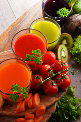 Glasses with fresh organic vegetable and fruit juices