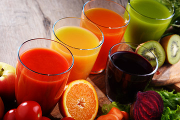 Glasses with fresh organic vegetable and fruit juices