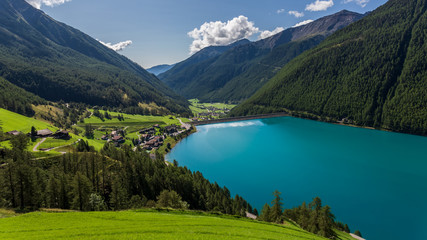 Fototapeta na wymiar Vernago lake landscape taken from surrounding mountains, Senales Valley, Italy