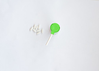 pills and throat spray on a white background