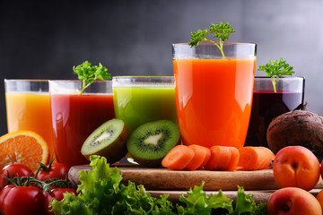 Glasses with fresh organic vegetable and fruit juices