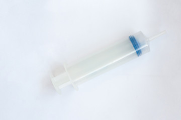 large syringe on a white background