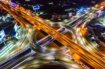Fototapeta na wymiar Aerial view and top view of traffic on city streets in Bangkok , Thailand. Expressway with car lots. Beautiful roundabout road in the city center.