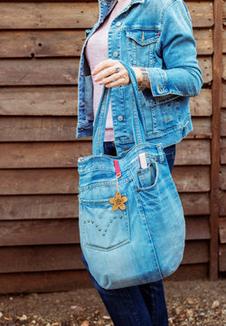 girl with a handmade jeans bag ,product concept woman's fashion