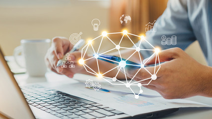 Businessman working on project for SWOT analyzing company financial report balance with augmented reality graphics at modern office space. Concept for business, economy, marketing and strategy.