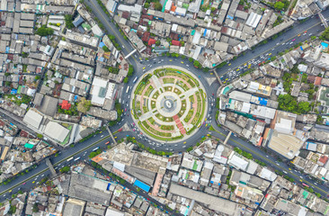 Road roundabout with car lots Wongwian Yai in Bangkok,Thailand. street large beautiful downtown at evening light. Aerial view , Top view ,cityscape ,Rush hour traffic jam © MAGNIFIER