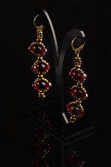 Handmade jewelry made of natural stones, isolated on black background