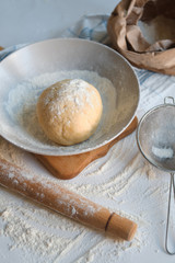 Knead dough from flour on the wooden table. Preparing the dough for baking. Cooking homemade cuisine for family. Chef workplace in kitchen. Making pastry. Healthy delicious culinary recipe