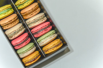 Closed-up colorful pastel macarons background