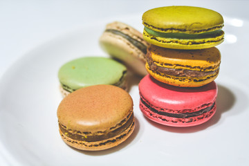 Closed-up colorful pastel macarons background