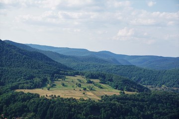 View over fields in the hilly terrain of Palatinate forest