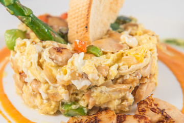 Detail of a plate of scrambled eggs with truffles