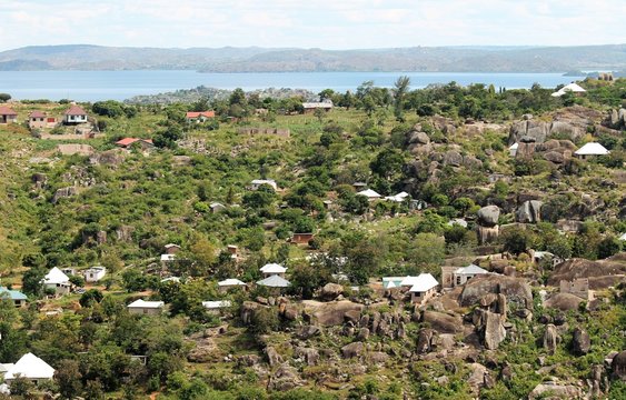 View of Lake Victoria, rock formations, houses from hilltop in Mwanza, Tanzania