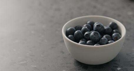 ripe blueberries in white bowl closeup