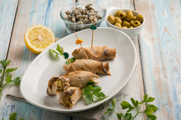 sword fish rolled up with capers and green olives