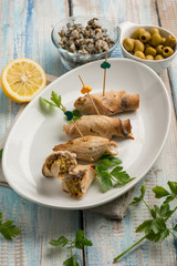sword fish rolled up with capers and green olives