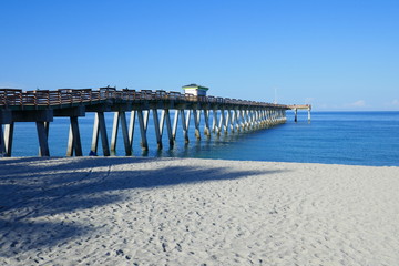 Pier from the beach over the ocean