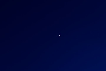 soft focus moon on dark blue night sky background long exposure nature photography with empty copy space for your text