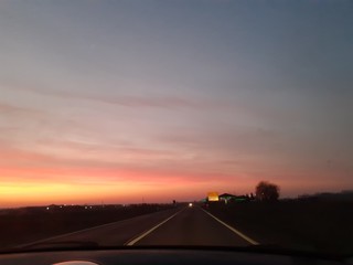 sunset over the road