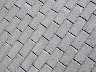 Sidewalk tile on the diagonal, top view, texture.
