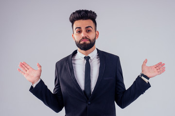 young handsome black hair man in stylish business suit in studio isolate white background