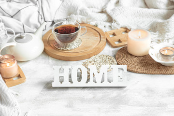 Cozy home still life with a Cup of tea and a teapot.