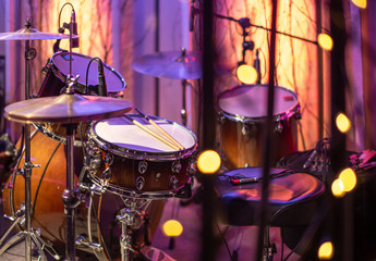 Drums, cymbals, hi hat on a beautiful background in the recording Studio. Room for musicians ' rehearsals. The concept of musical creativity.