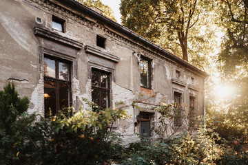 photo of an old house in the nature