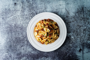 Minced beef tomato sauce pasta in a white plate