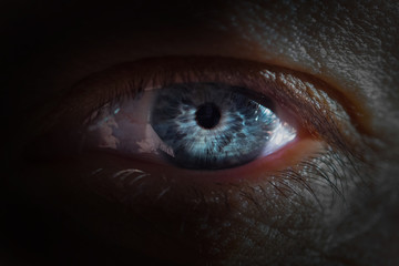Close Up of human blue eye.