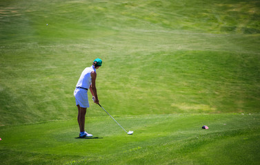 Woman Playing Golf in Quinta do Lago Algarve Portugal