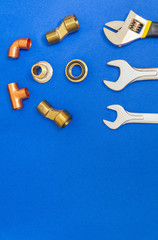 Set of tools for plumbing isolated on blue background with space for advertising