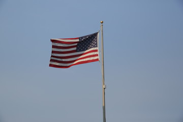 american flag on blue sky with copy space for text