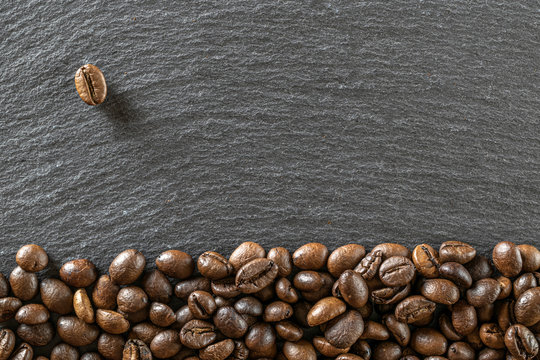 Black coffee background. Caffeine espresso beans for breakfast dark drink in cup. Cafe food. Assorted ground and instant brown roasted coffee seeds on stone. Copy space, top view