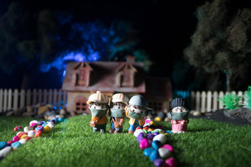 Miniature people : Merchants and citizens wearing masks to protect against viruses at the market. People wear masks to prevent New type COVID-19 pneumonia. Coronavirus and Covid-19 concept.