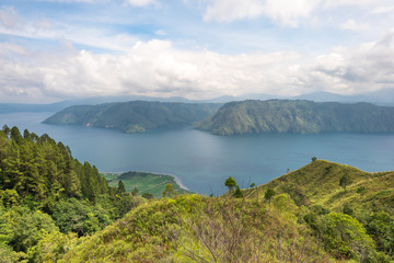Naklejka na ściany i meble Lake Toba, the largest volcanic lake in the world situated in the middle of the northern part of the island of Sumatra in Indonesia