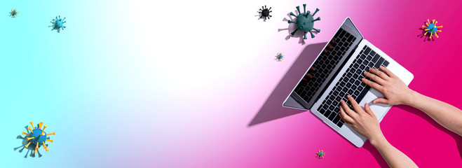 Fototapeta na wymiar Laptop computer with epidemic influenza concept - overhead view