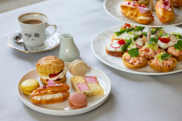 Traditional afternoon tea with canapes and cakes