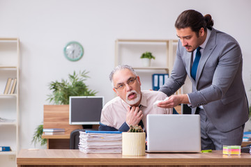 Two employees in pandemic concept at workplace