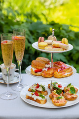Traditional afternoon tea with canapes and cakes