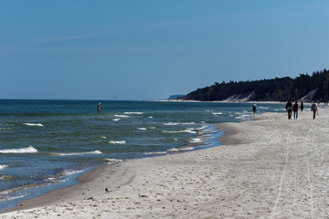 people walking on the beach Dębki