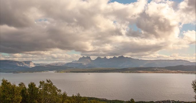 Time lapse at noon. Great moving clouds-cloudscape. The Bay in Bodo, Norway.