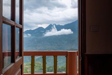Sa Pa valley and mountain range from an hotel room doorway, Vietnam