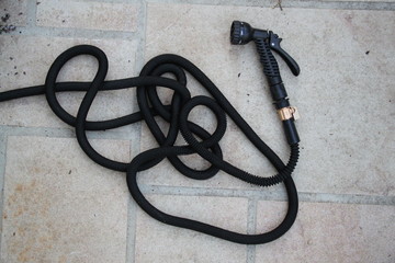 Light extendable black new garden hose and shower