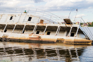 The sunken passenger ship tilted in shallow water