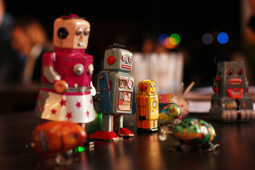 Colorful USSR mechanical robot toys on the table.  