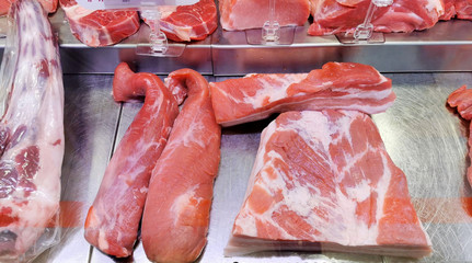 
meat laid out on a storefront for sale