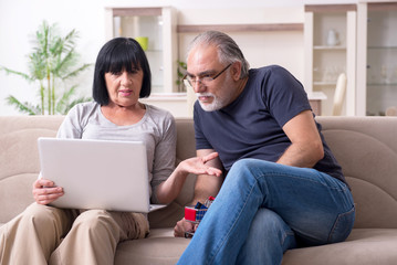 Old couple doing the online shopping